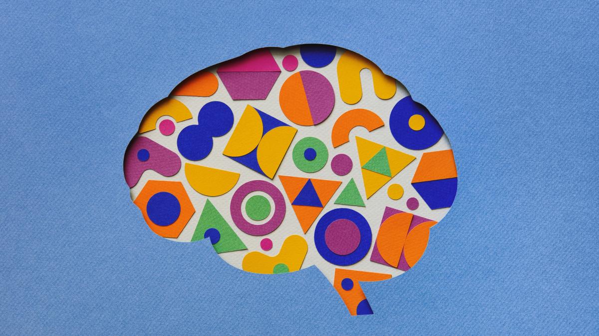 A brain with colourful shapes on a blue background