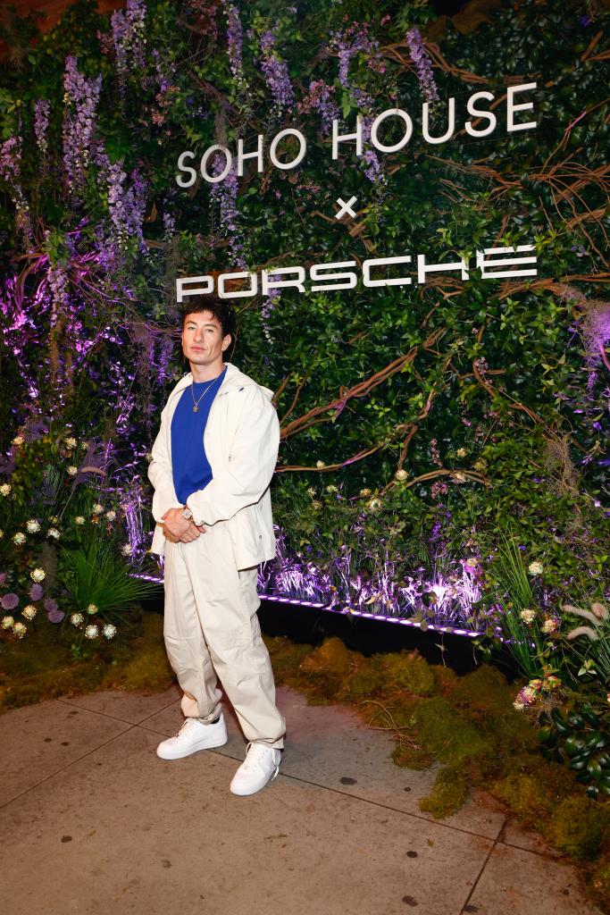 barry keoghan in front of the soho house x porsche sign